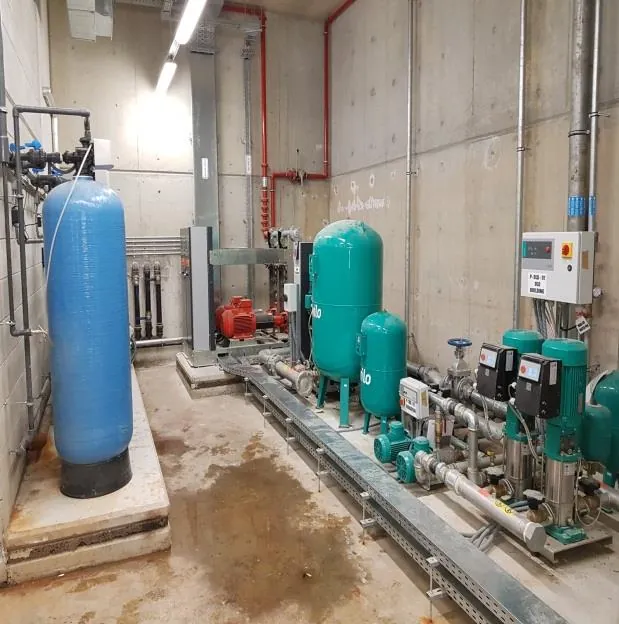 Treatment vessels and booster pumps in plant room