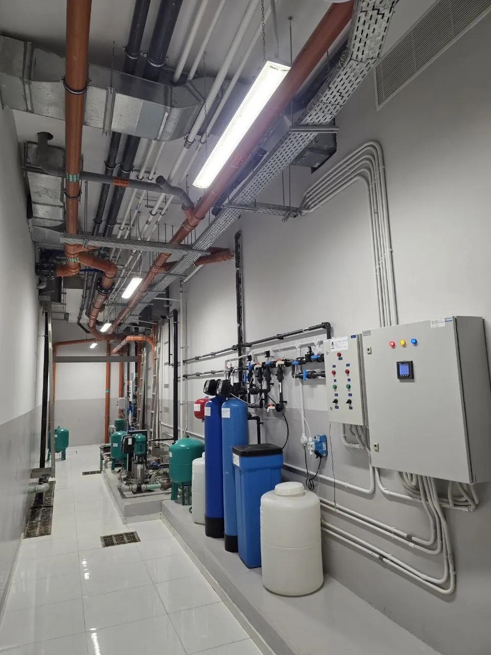 Water treatment and booster pumping in services corridor - Villa Fawaz